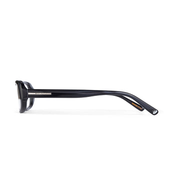 Black eyeglasses by hot futures shot from the side against a white background