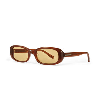 Side Shot of Aurora Rectangular slim sunglasses in brown gold, showing the "Hot Futures" minimal gold branding on the arms