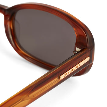 Hot Futures Eco Caramel frame close up with Dark Green lenses. The gold HF branding down the arm is shown and alloy hinges visible in image. Showing their true high quality.