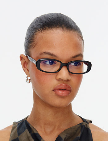 Model wears the Aurora Gloss Black Prescription Glasses, shot at a side angle