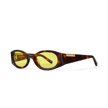 Sunglasses with tortoiseshell frame and yellow lenses on a white background