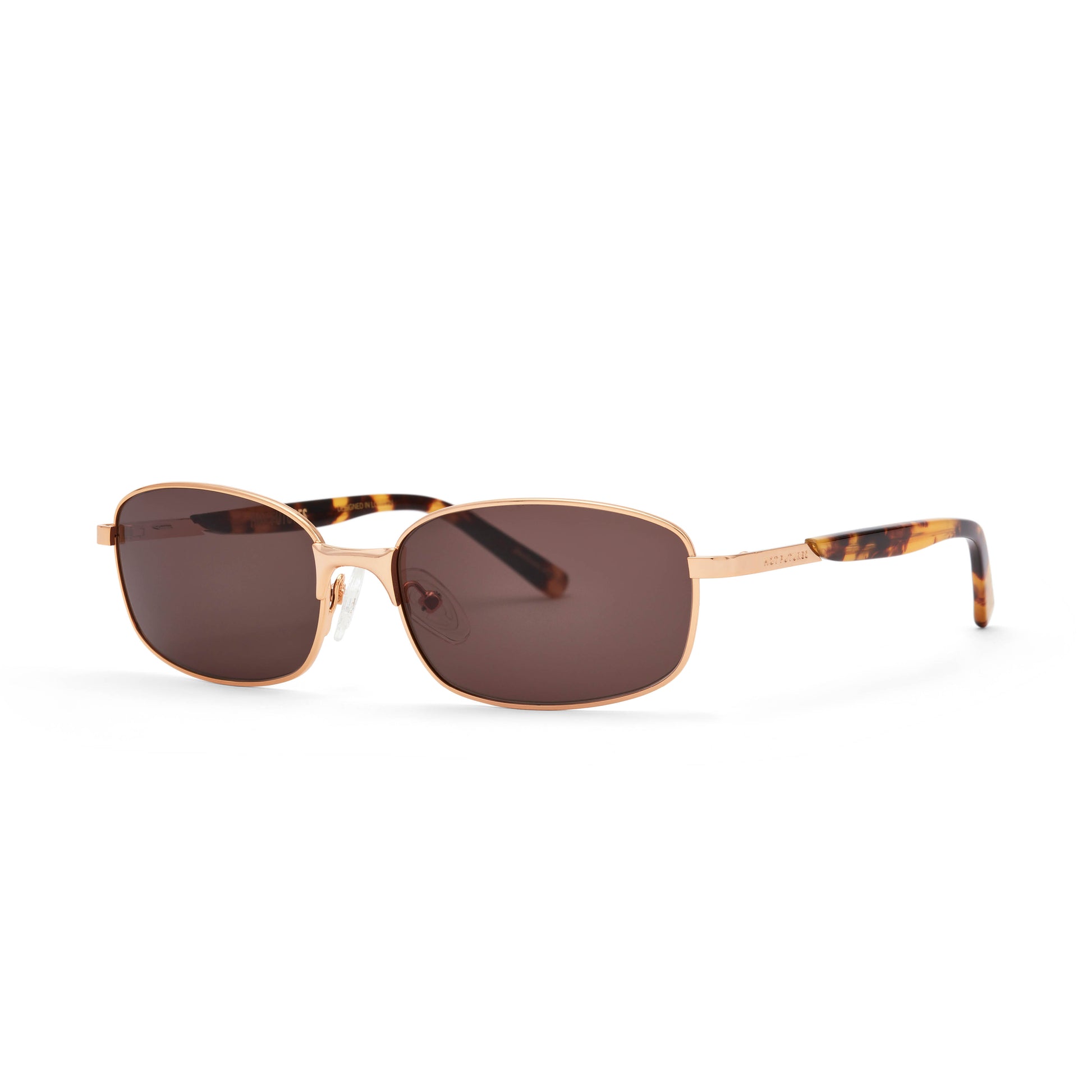 Sunglasses with gold frame and tortoiseshell accents on a white background