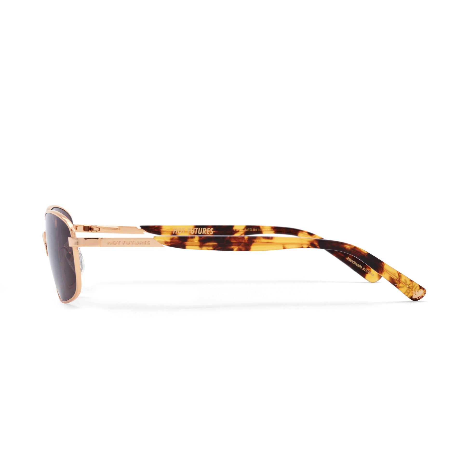 Sunglasses with tortoiseshell frame and dark lenses on a white background