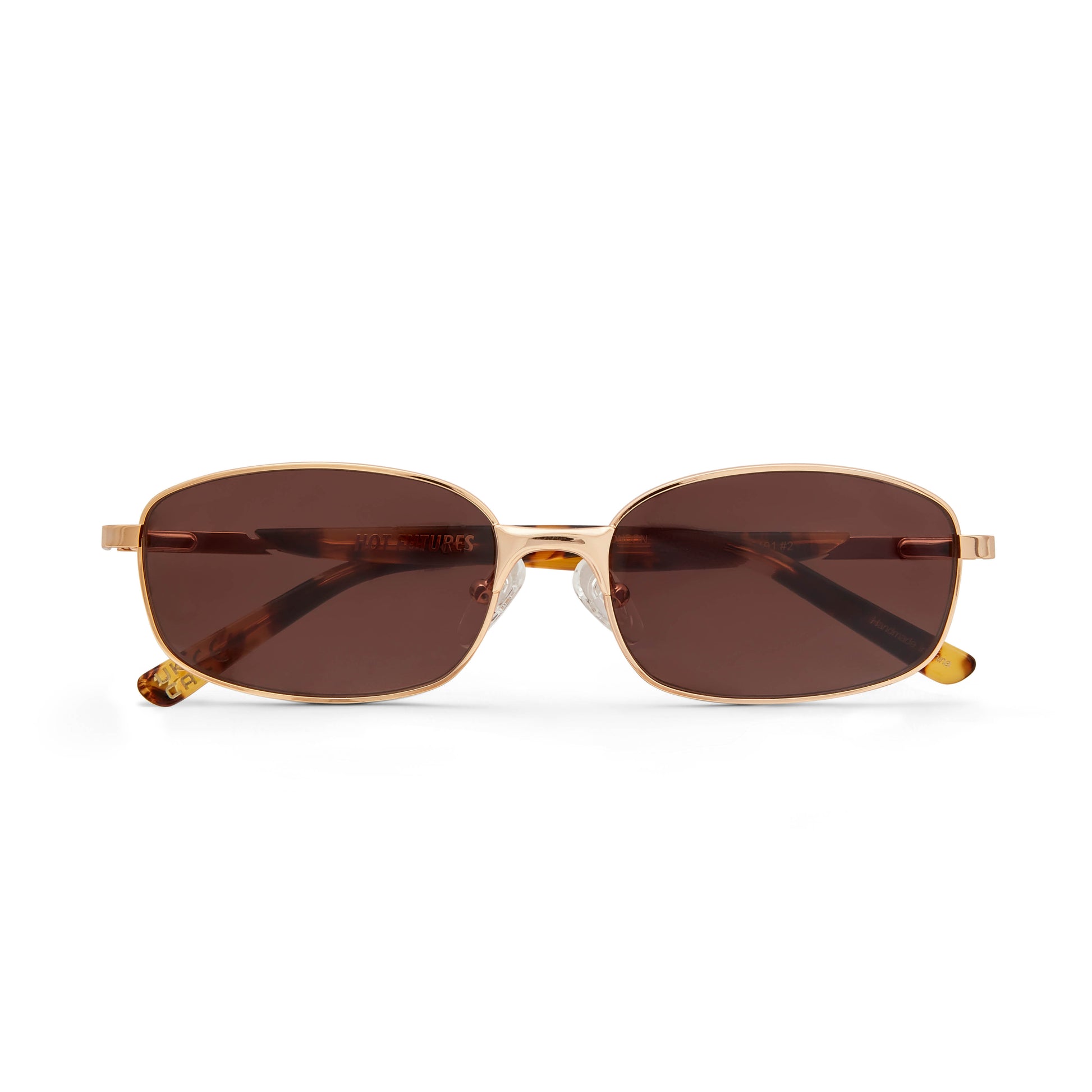 Gold-framed sunglasses with brown lenses on a white background