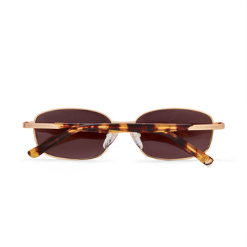 Sunglasses with tortoiseshell frame and brown lenses on a white background