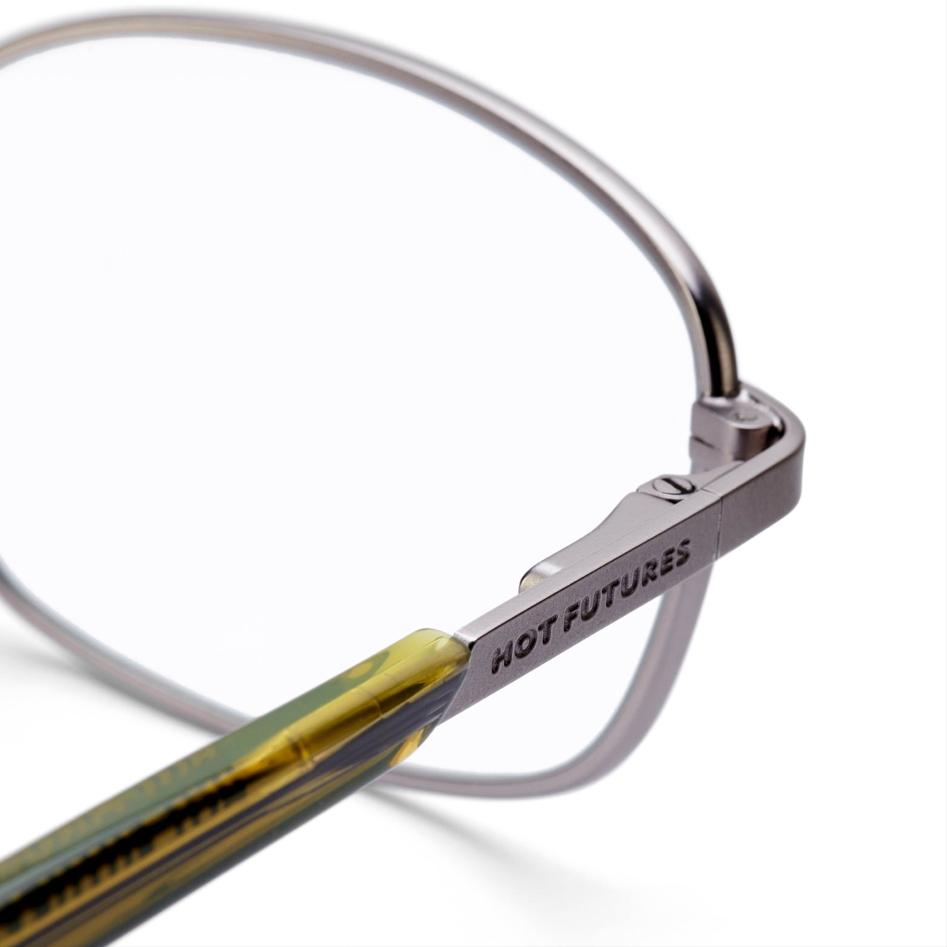 close up shot of blaze gun metal glasses showing HF branding 