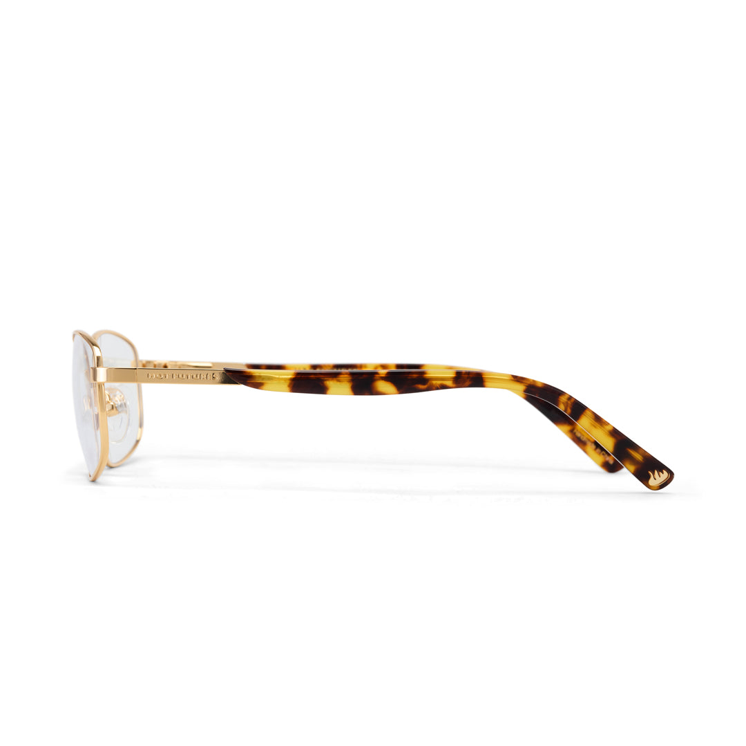Eyeglasses with tortoiseshell frame and gold accents on a white background