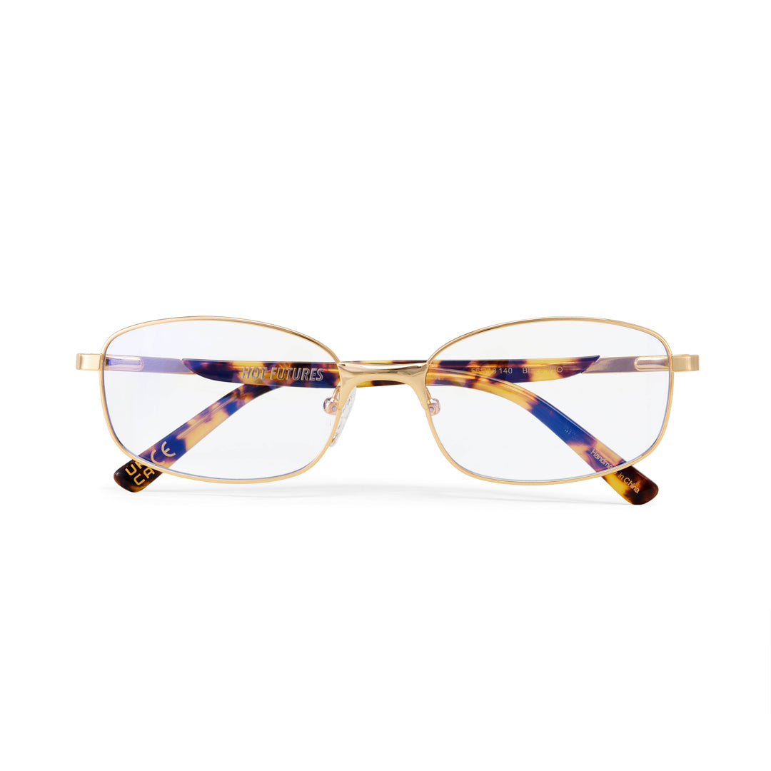 Eyeglasses with a gold frame and tortoiseshell accents on a white background