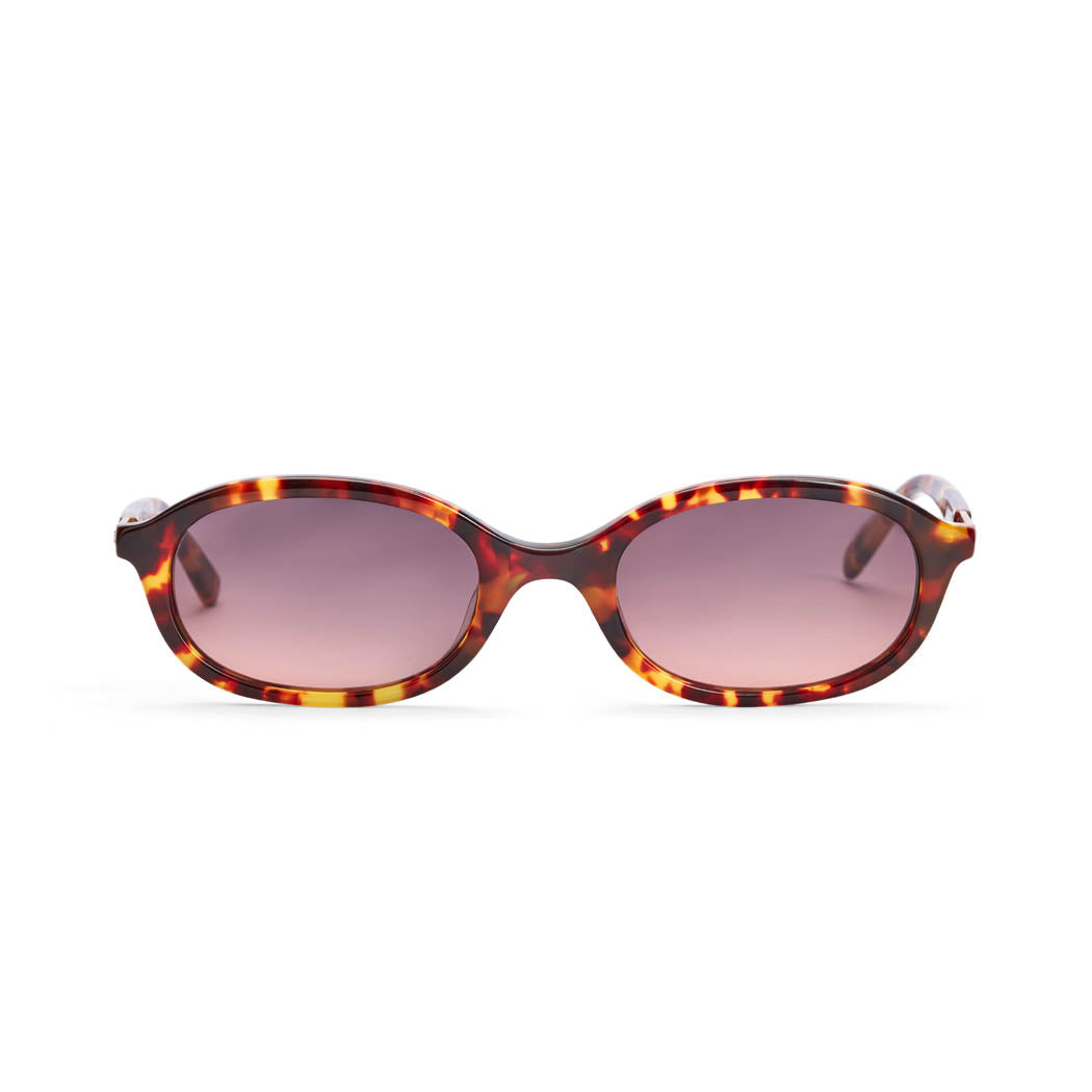 A pair of amber tortoiseshell sunglasses with tan lenses, featuring an elliptical frame design.