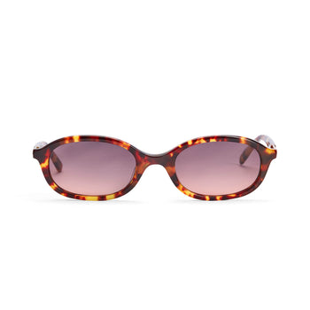 A pair of amber tortoiseshell sunglasses with tan lenses, featuring an elliptical frame design.