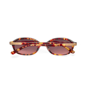 back shot of the cupid tortoiseshell sunglasses folded against a white background
