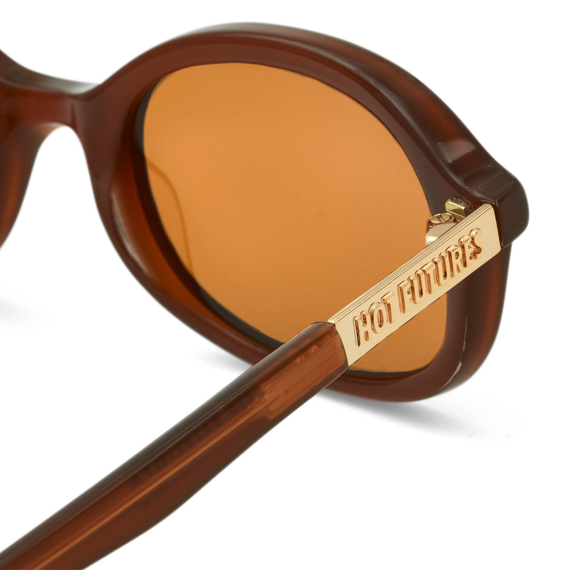 close up shot of the cupid sunglasses showing the gold Hot Futures branding