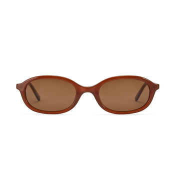 A pair of brown oval sunglasses with gold accents on the arms.