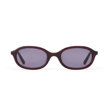 Sunglasses with a dark cherry frame and dark smoke lenses on a white background