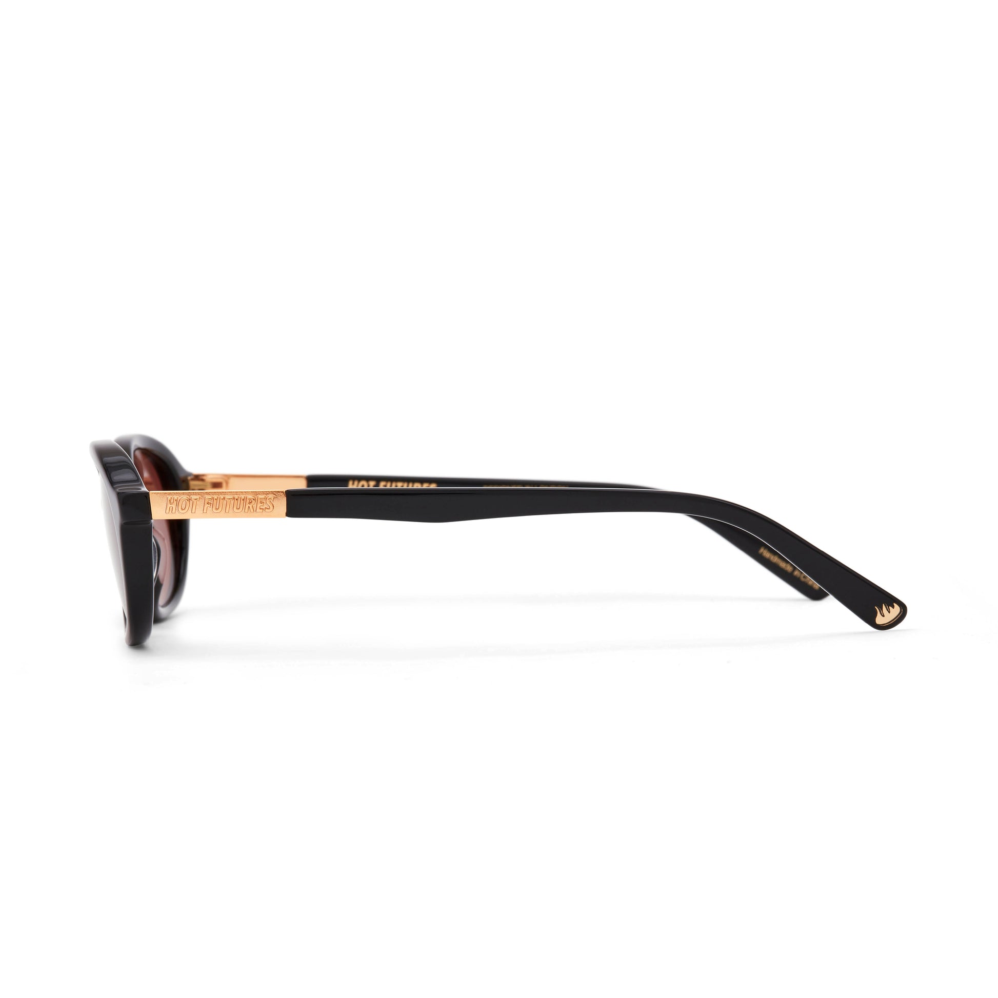 Sunglasses with black frame and gold accents on a white background