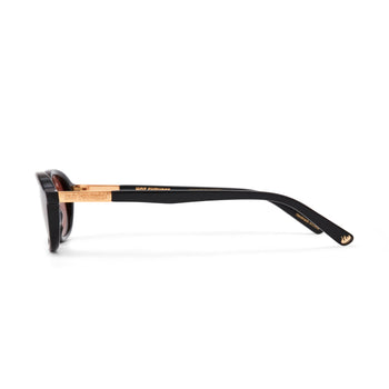 Sunglasses with black frame and gold accents on a white background