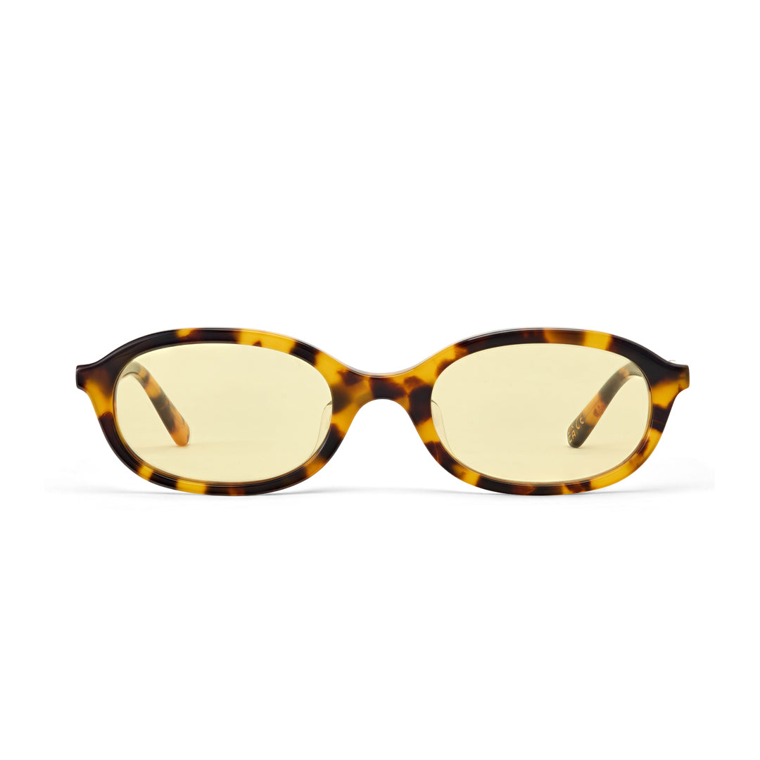 Sunglasses with tortoiseshell frame and yellow lenses on a white background