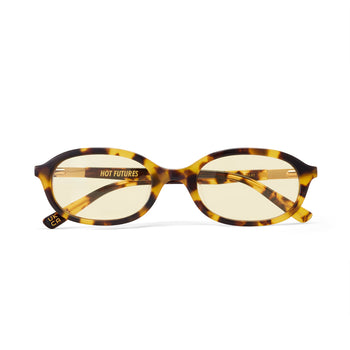 Sunglasses with tortoiseshell frame and yellow lenses on a white background