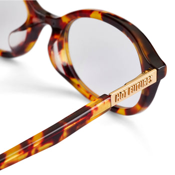 Tortoiseshell glasses with gold frame and 'Hot Futures' gold branding on a white background