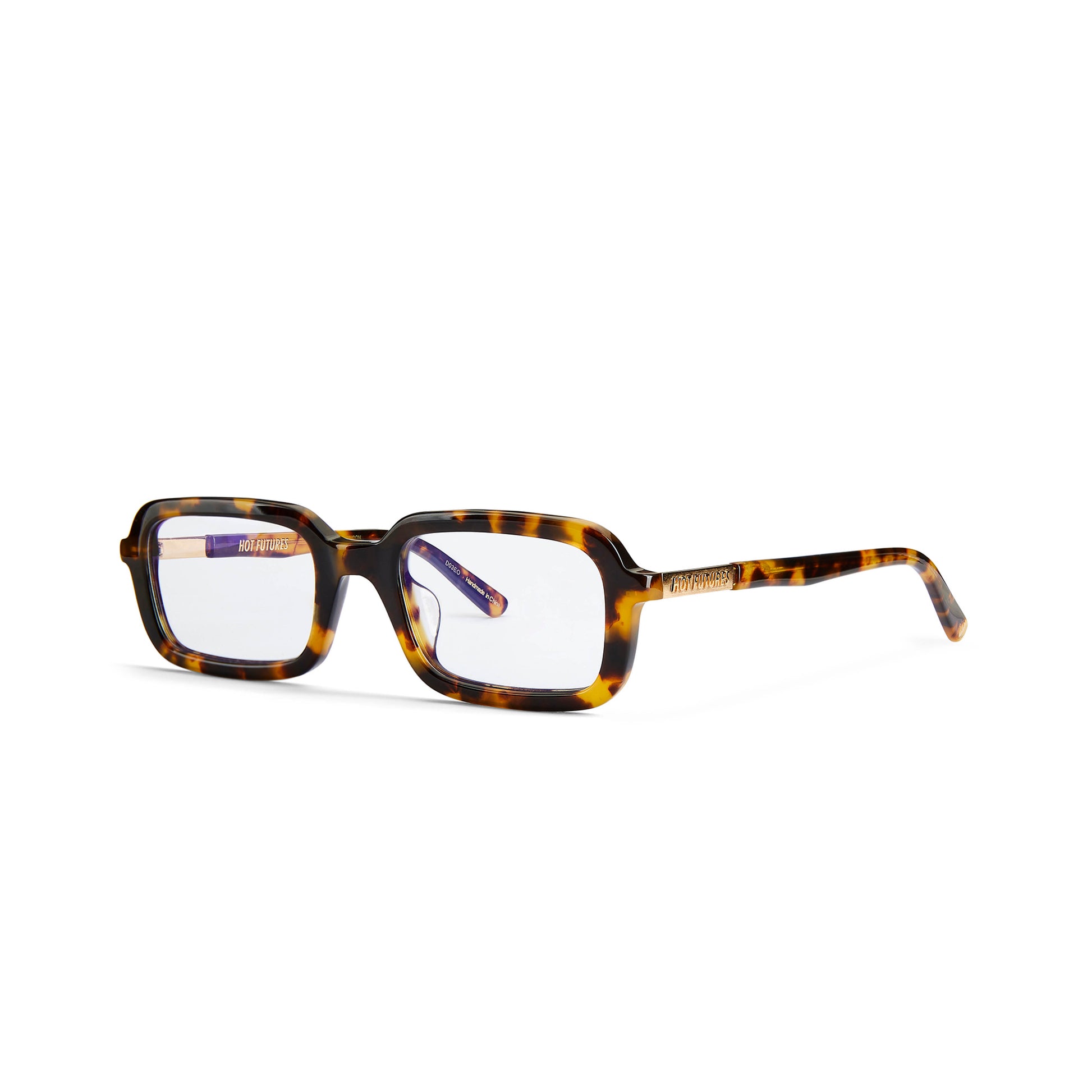 A pair of eyeglasses with a tortoiseshell pattern frame and clear lenses, featuring a Y2K inspired design with a slim rectangle frame.