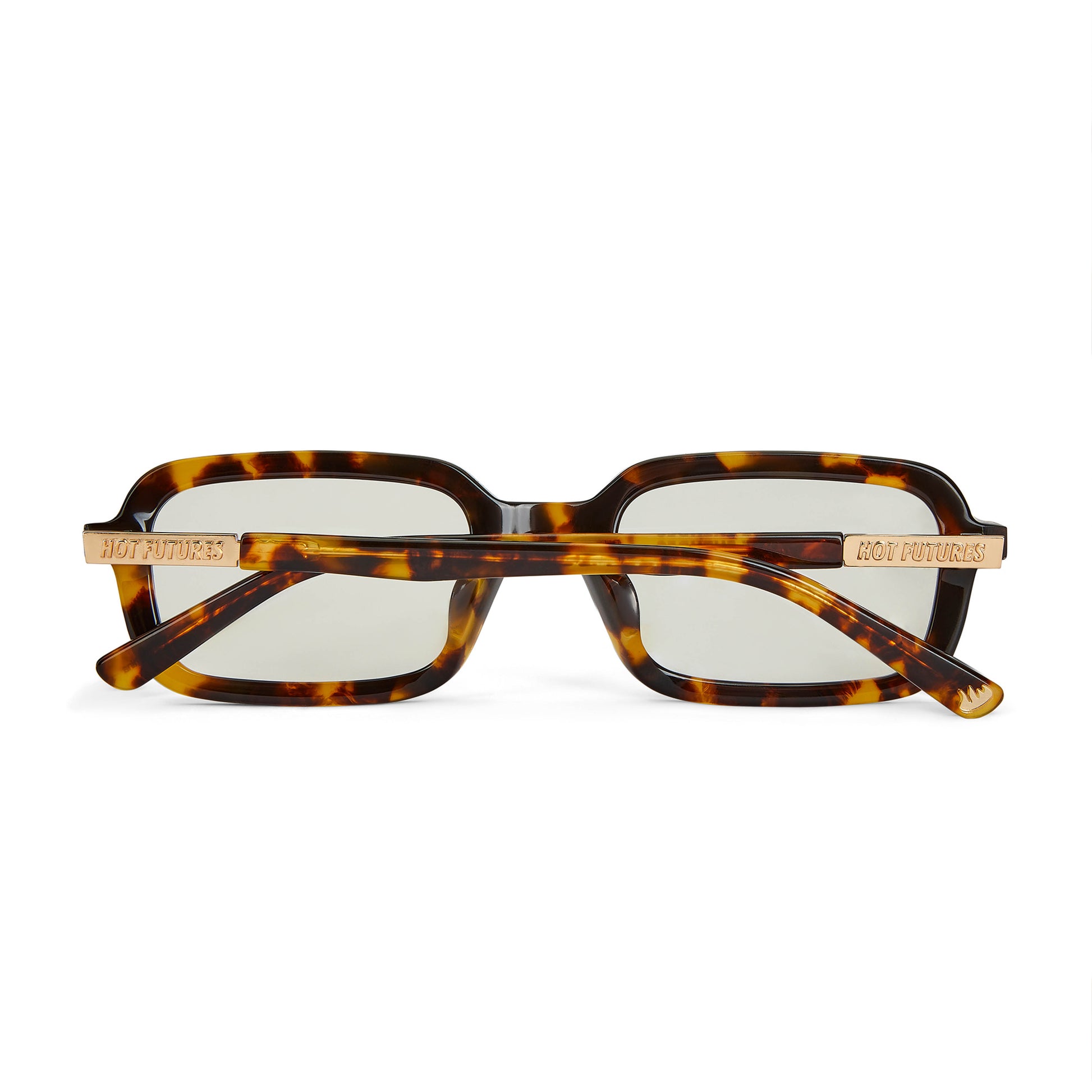 A pair of eyeglasses with a tortoiseshell pattern frame and clear lenses, featuring a Y2K inspired design with a slim rectangle frame.