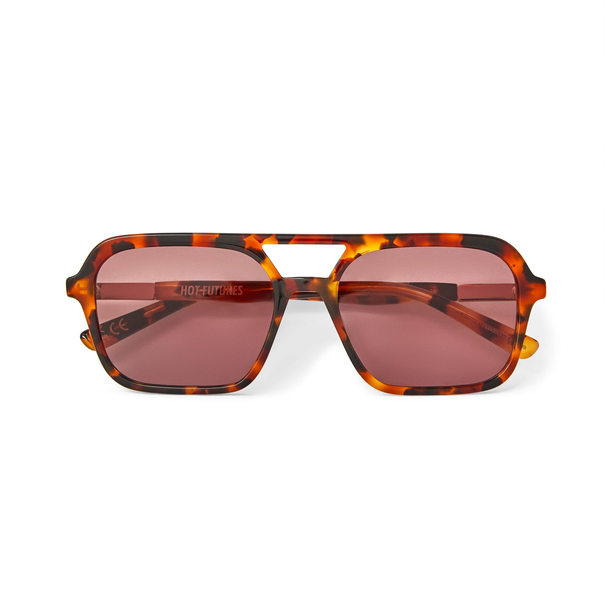 A pair of tortoiseshell patterned sunglasses with a slim rectangular aviator frame 