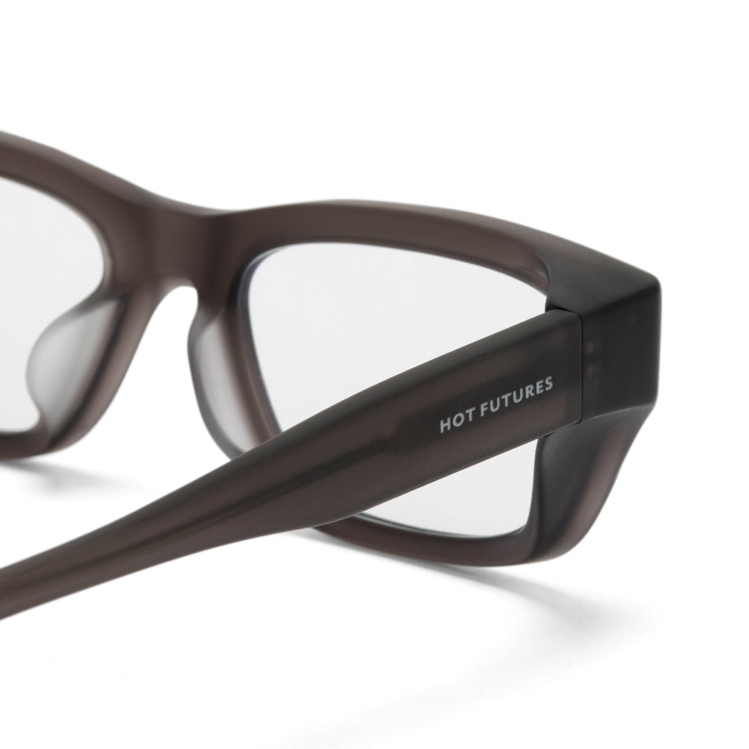 Brown eyeglasses with 'HOT FUTURES' branding on a white background