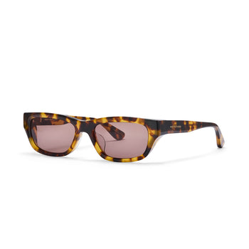 Sunglasses with tortoiseshell frame and pink lenses on a white background