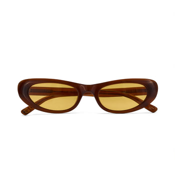 Brown sunglasses with yellow lenses on a white background