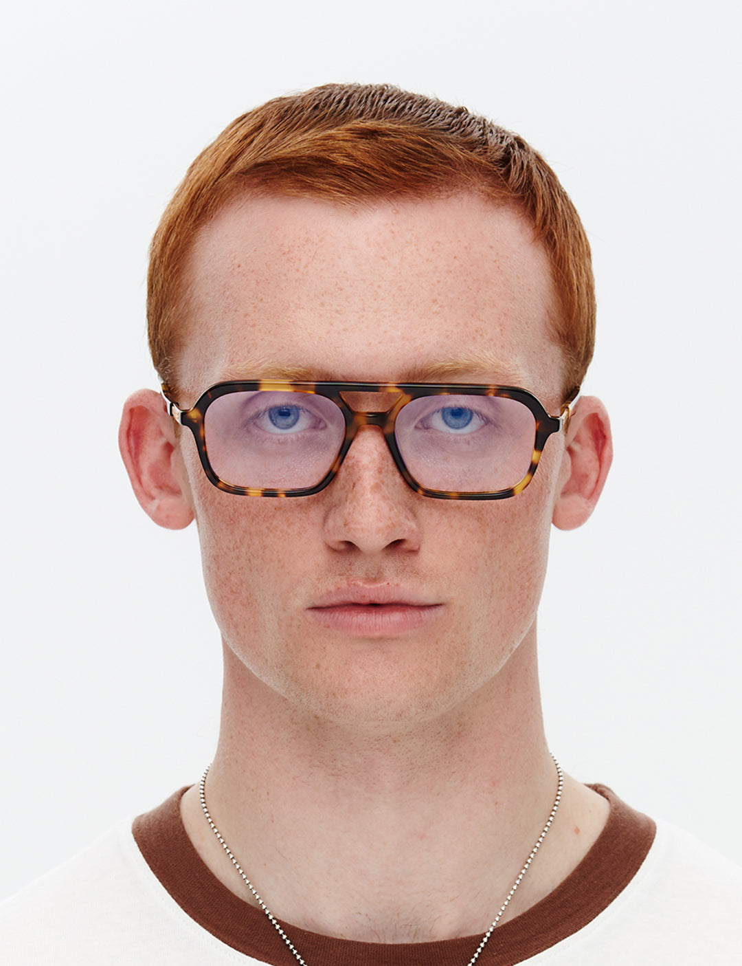 Tortoiseshell optical glasses on a white background