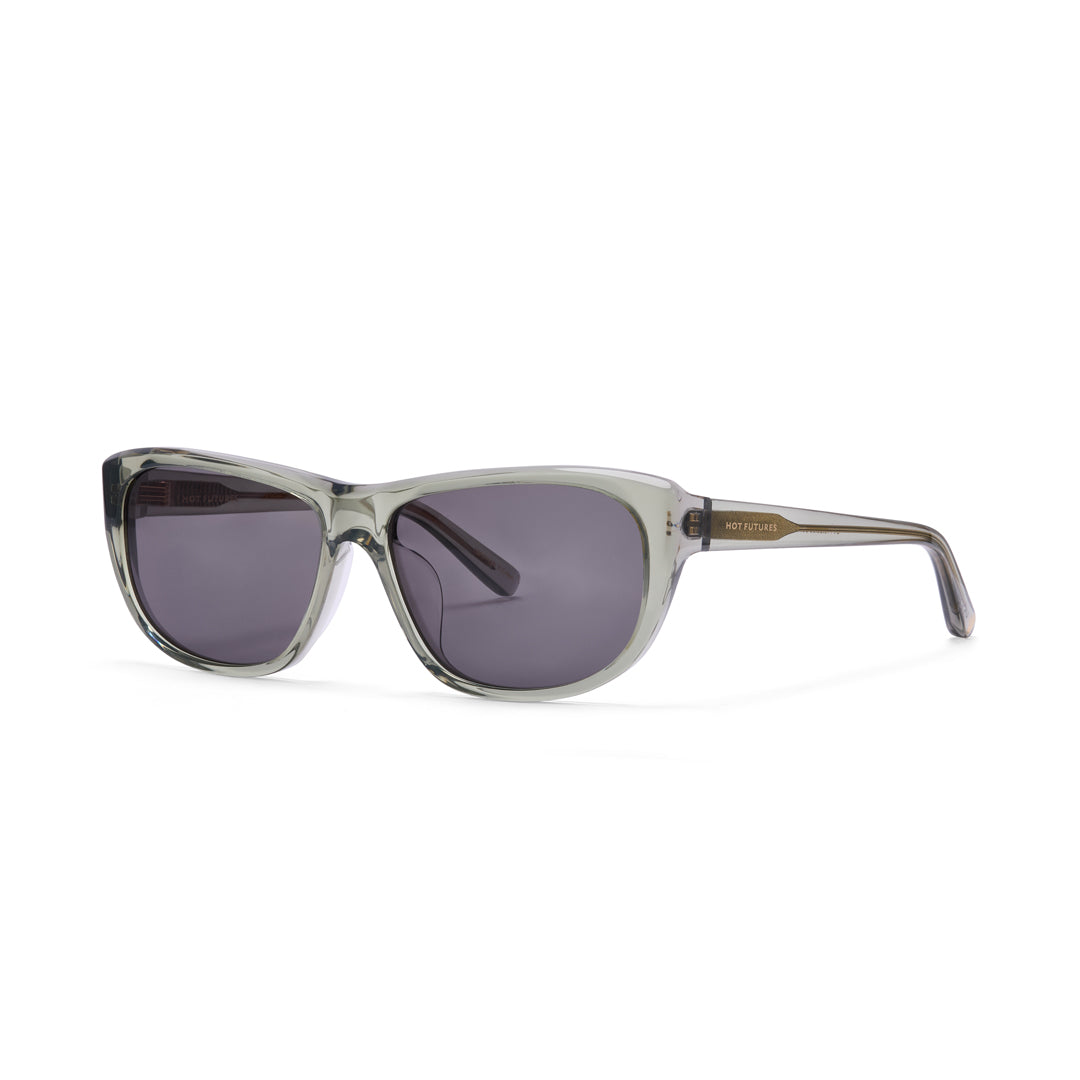 Sunglasses with a clear frame and dark lenses on a white background