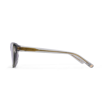 Sunglasses with gold frame and clear arms on a white background