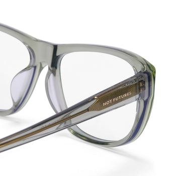 Clear eyeglasses with gold accents on a white background, featuring the brand 'Hot Futures'.