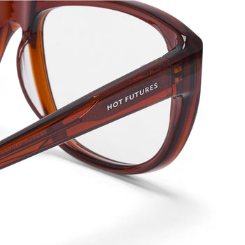 Brown eyeglasses with 'HOT FUTURES' branding on a white background