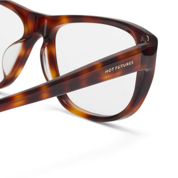 Brown tortoiseshell glasses with 'HOT FUTURES' label on a white background