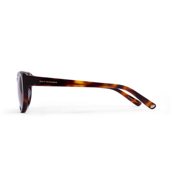 Sunglasses with tortoiseshell frame on a white background