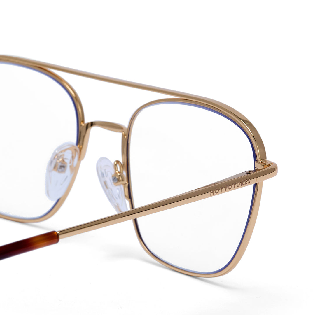 Gold-framed eyeglasses on a white background